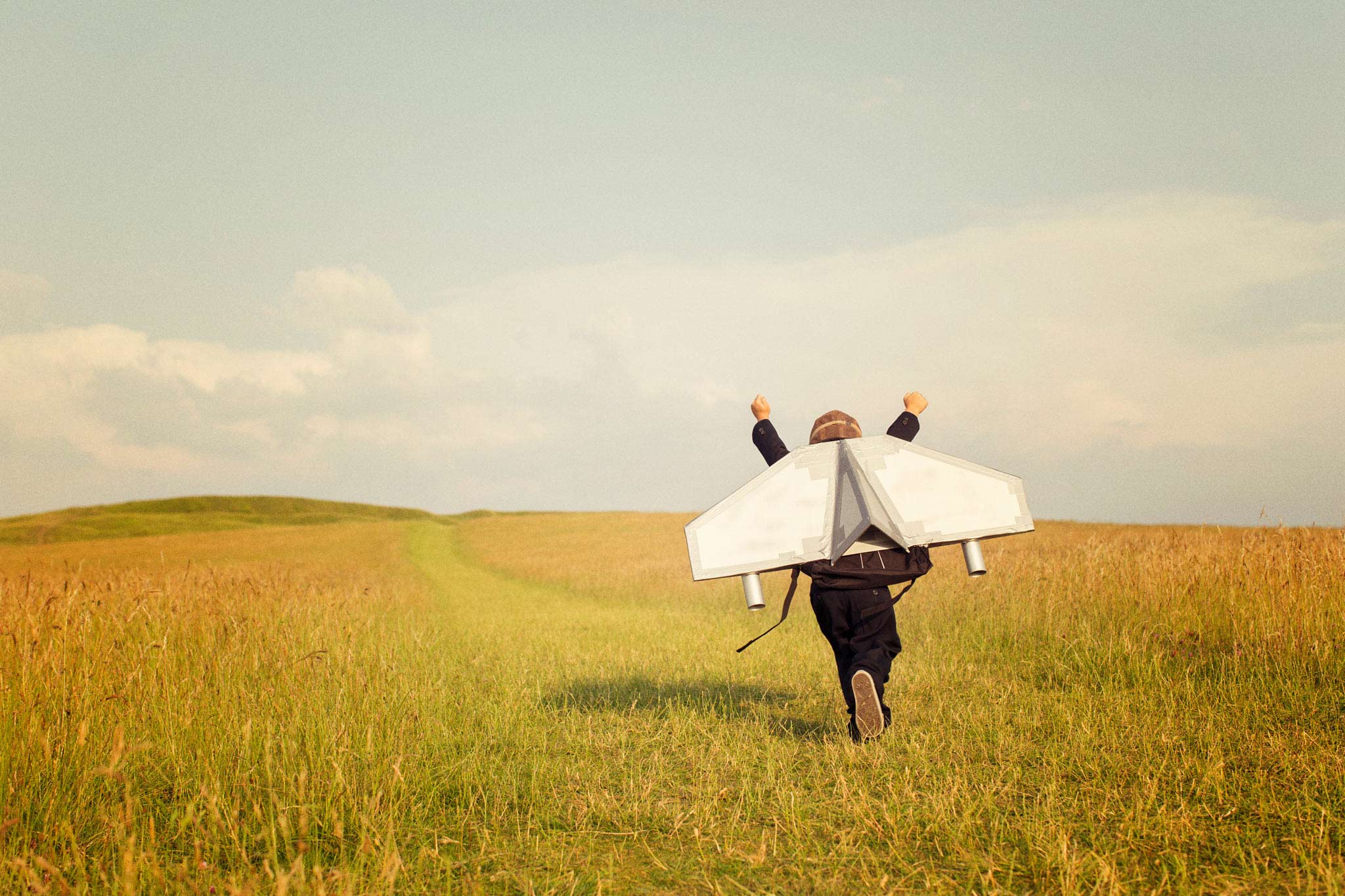 Young Business Boy Wearing Jetpack in field. Photo: iStock.com/Rich Vintage
