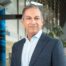 Modern interior portrait of Sherrif Karamat, CAE, President and CEO of PCMA and CEMA.
